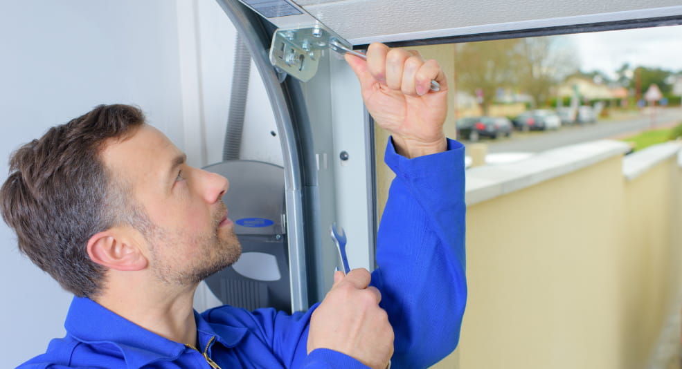 Man fixing garage door.