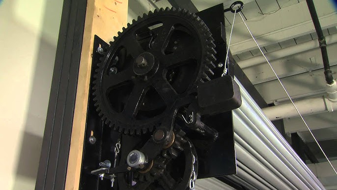 Fire door coil and gear mechanism on a commercial rolling fire-rated garage door used for automatic emergency closure.